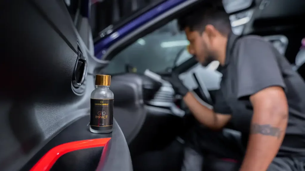 a detailer applies graphene ceramic coating on to the car