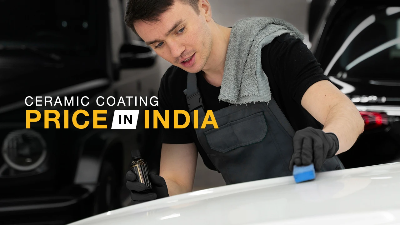 A worker applies ceramic coating for cars on the bonnect of an SUV
