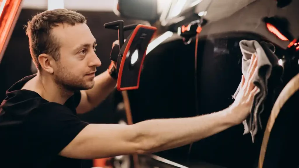 a black car being detailed and finished off