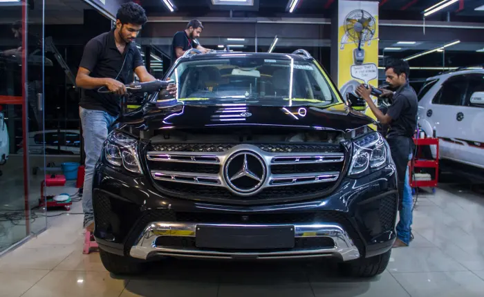 A car being detailed in a detailing studio