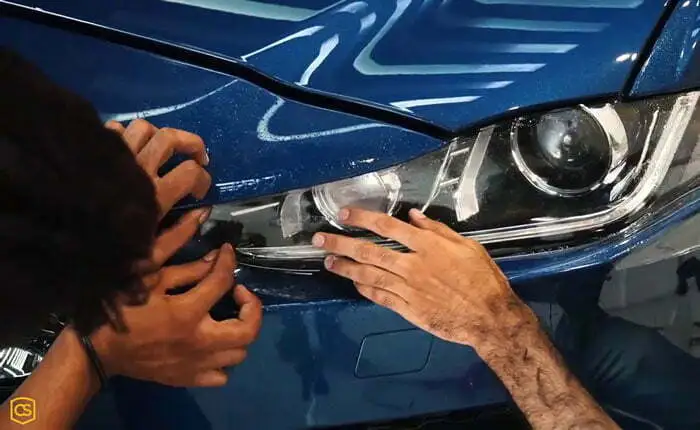 A PPF being installed on a car