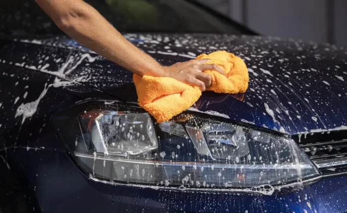 A black car being washed