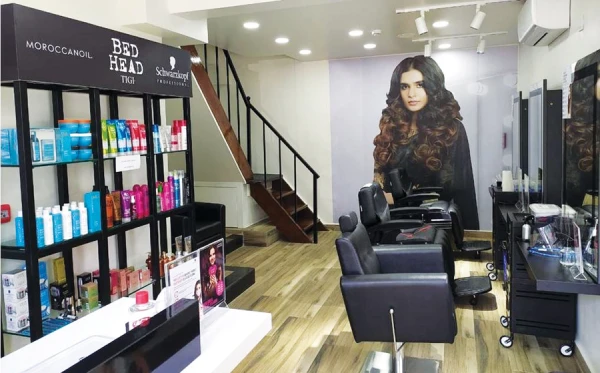 A hair salon with black chairs and modern decor