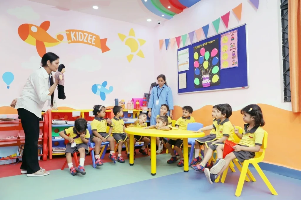 A tutor teaches young students in a Kidzee centre in Delhi