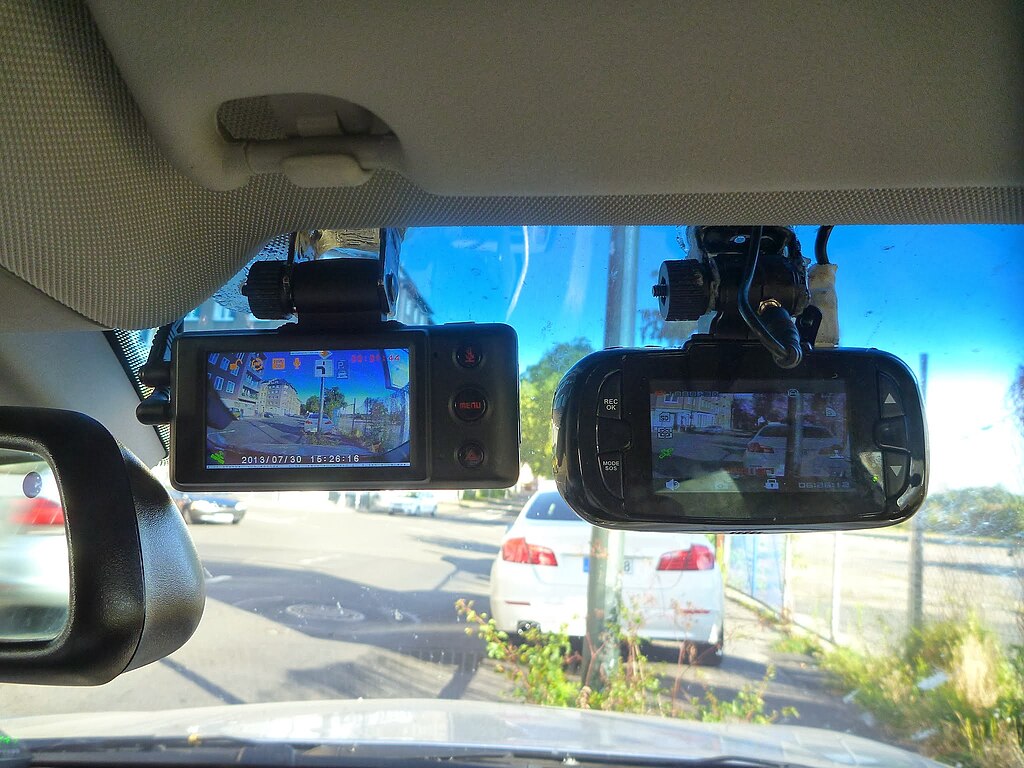 Two dashcams on a windshield