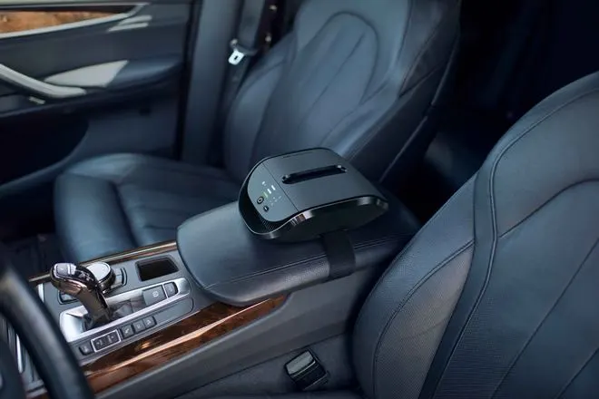 A car interior with an air purifier