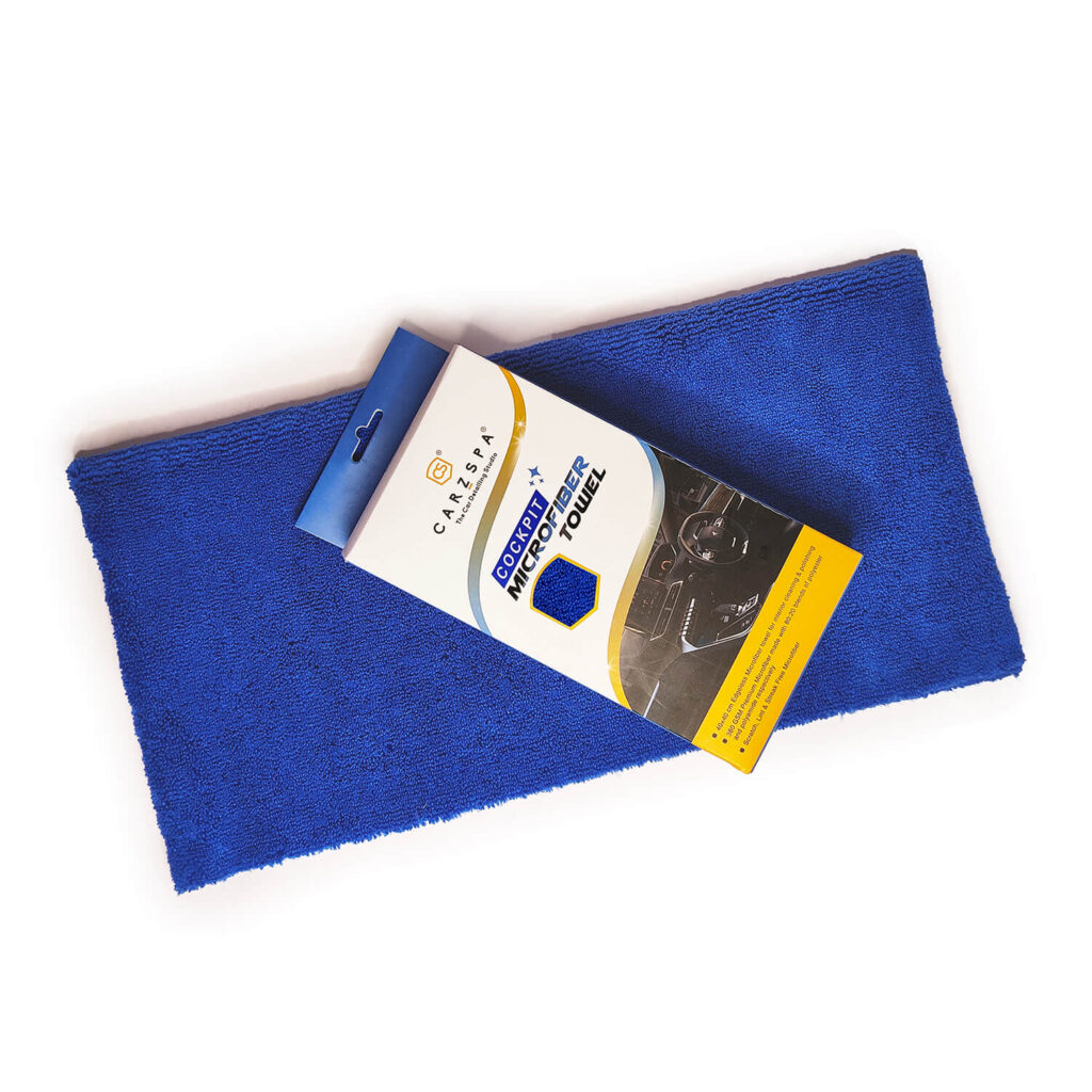 A Blue microfibre cloth by CarzSpa that’s used to clean car body