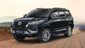 Close-up view of a black Toyota Fortuner on a rugged terrain