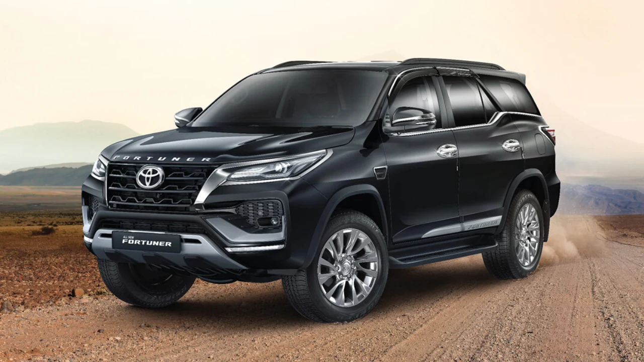 Close-up view of a black Toyota Fortuner on a rugged terrain