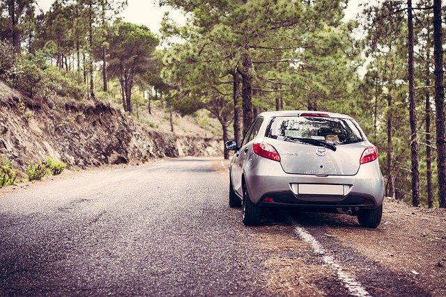 A car parked on the side of the road on the countryside while on a roadtrip