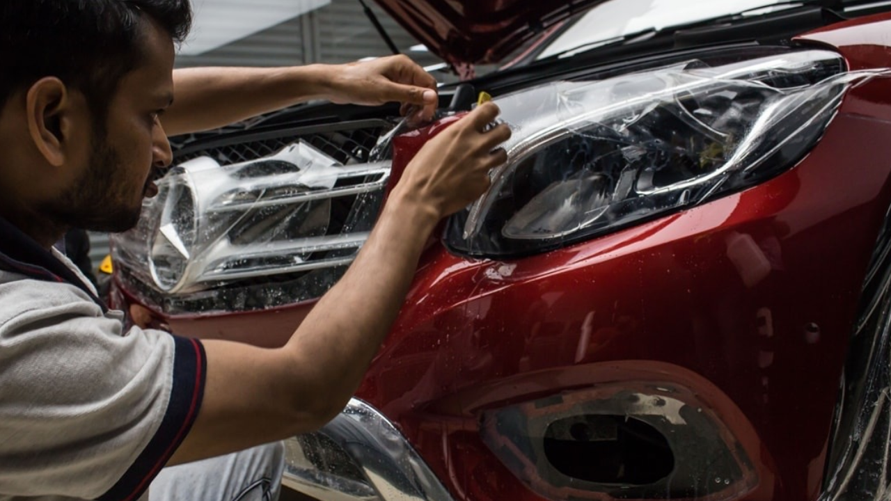 Car with glossy paint reflecting sunlight, highlighting PPF protection