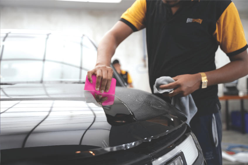 Professional car detailing facility with advanced equipment and a customer service area