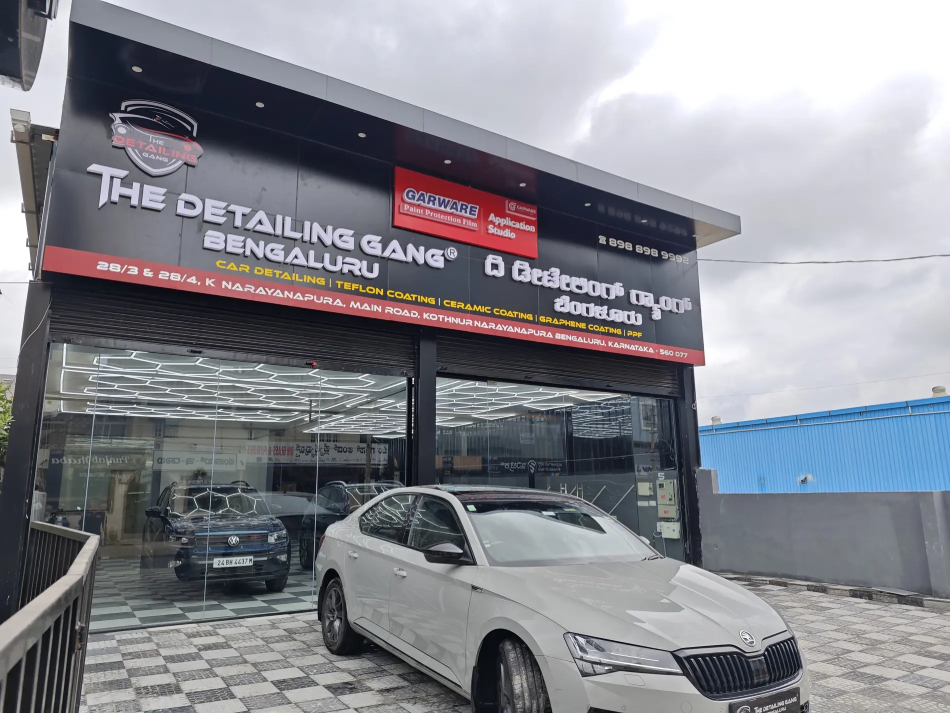 Contemporary car detailing studio with team members and premium equipment