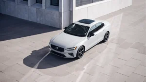 A shiny white Volvo S60 photographed in an outdoor setting