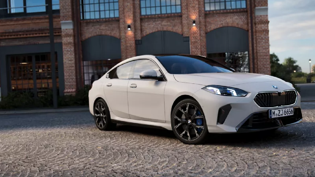 A close-up shot of a sleek white BMW 2 Series Gran Coupe parked on a street, its polished exterior reflecting the light, ideal for a professional PPF application.