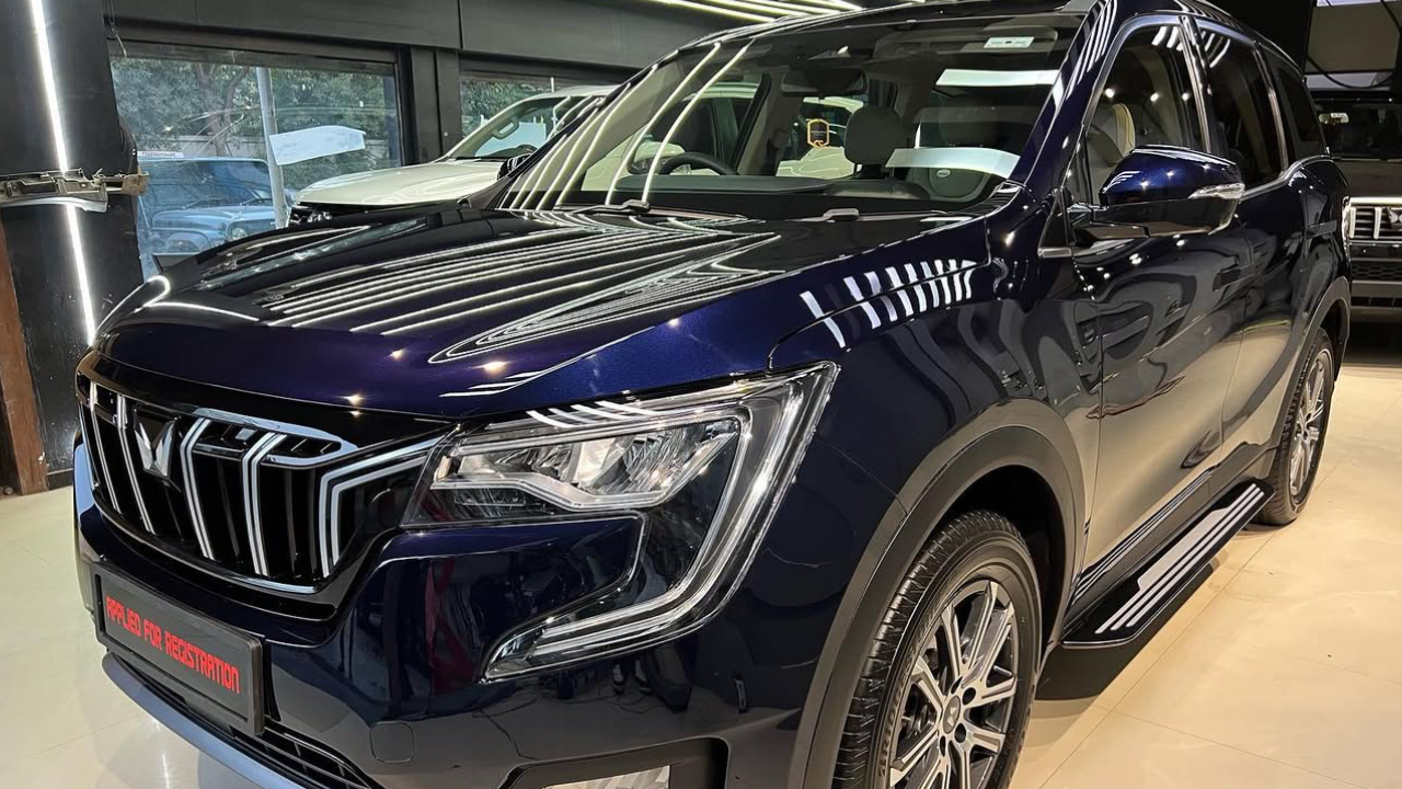 A striking blue Mahindra XUV 700 shining at a detailing studio after getting PPF installed