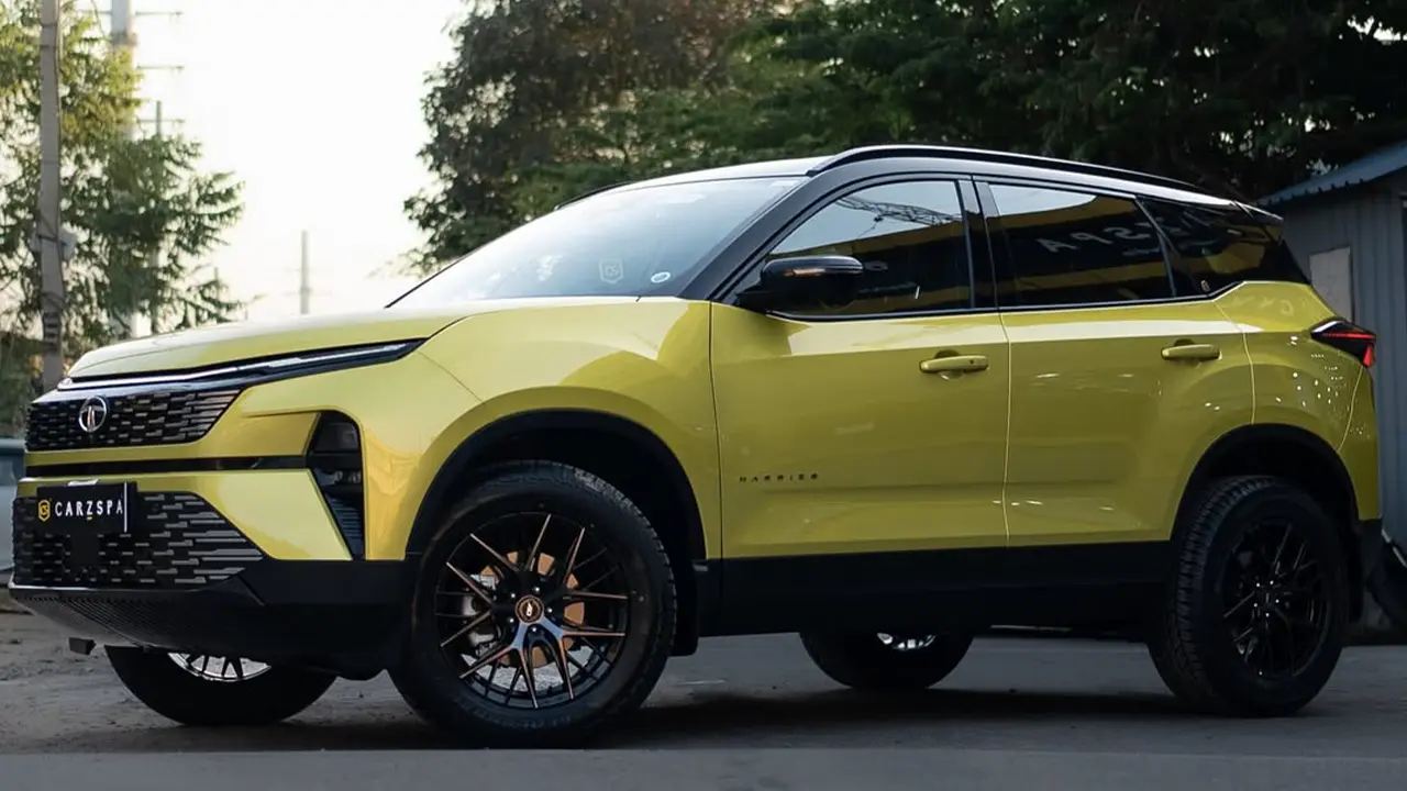 A shiny green Tata Harrier at a detailing studio after getting PPF installed