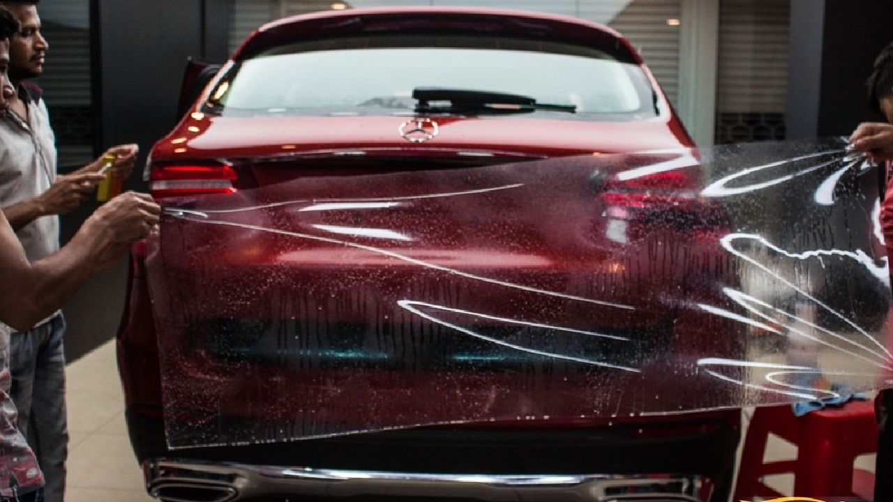 Visual of a red luxury SUV visible through a blue of a clear PPF