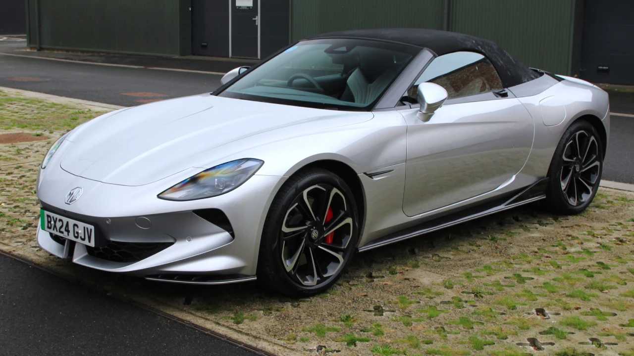A shiny Red MG Cyberster at a Car expo.