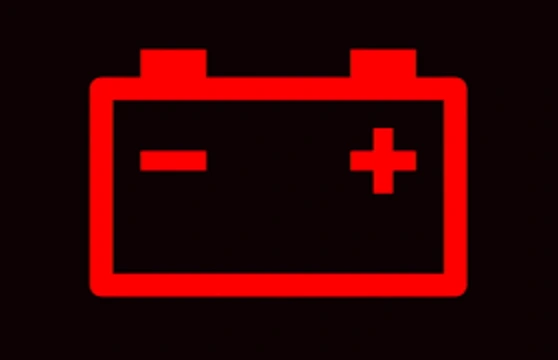 red battery symbol on car dashboard