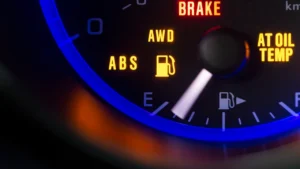 Modern car dashboard showing various warning lights and symbols