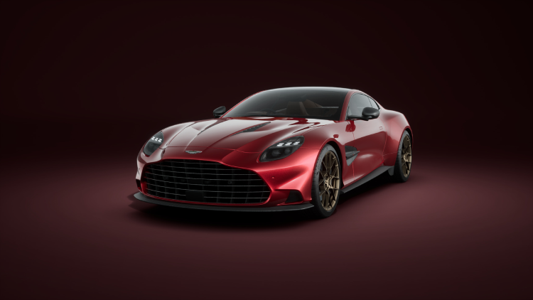 A red Aston Martin Vanquish parked in an interior space