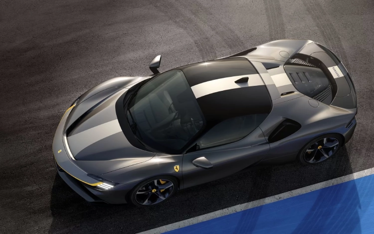 A Ferrari SF90 drives on a race track