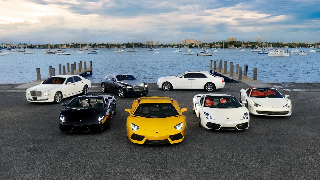 A row of luxury cars lined up at a pier