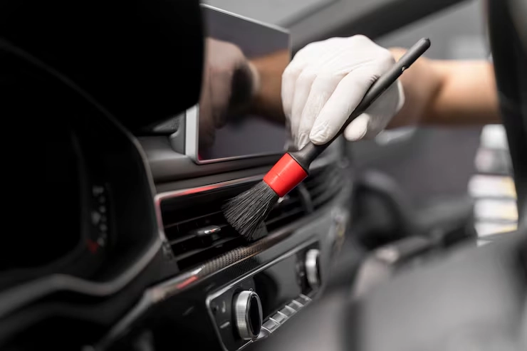 close-up shot of the interior of a car being detailed