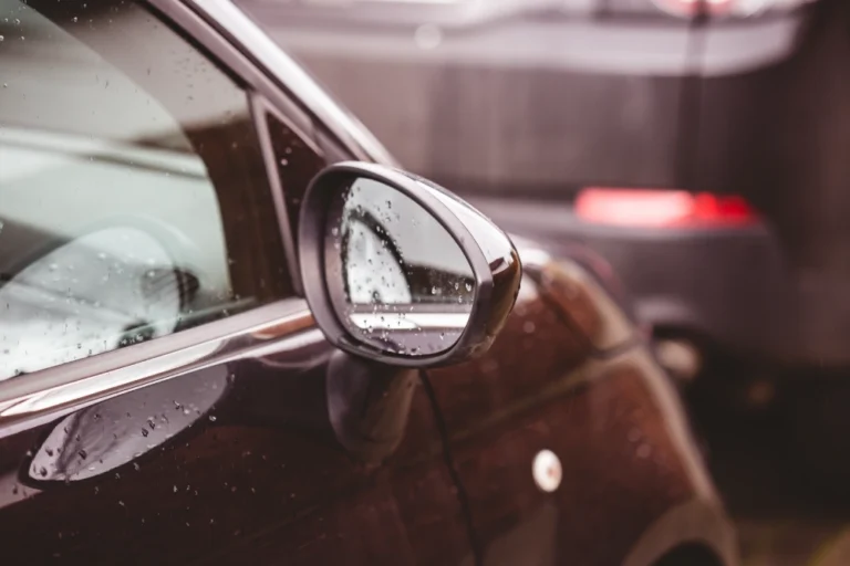 A ceramic-coated car looking shiny after rain