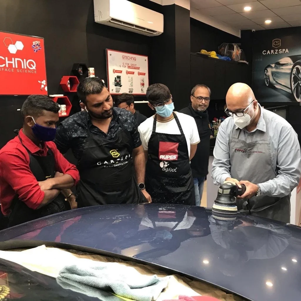 Mr. Anckur Sama training budding car detailing business owners at his training studio