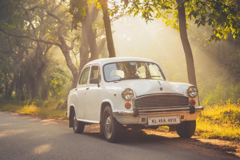 An old image of a Hindustan Ambassador car with a visible number plate