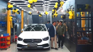 A few people inspecting a newly set up car detailing studio