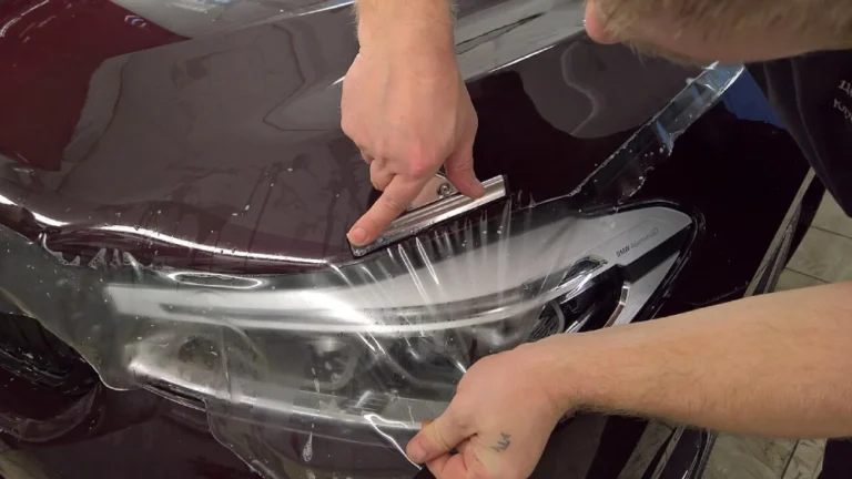 PPF being applied on bonet of a black car.