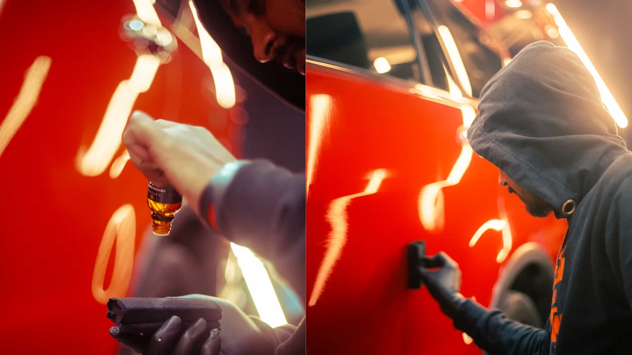 Professional detailer applying ceramic coating to the bonnet of a black luxury sedan.