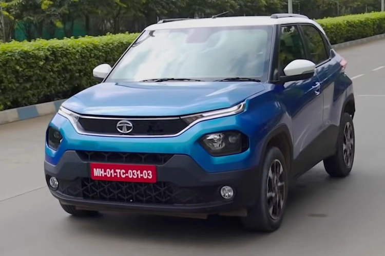 A Tata Punch drives through an Indian street