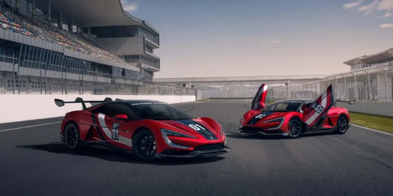 Two red and white YANGWANG U9 Xtreme models parked on a racetrack
