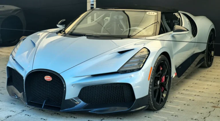 A white Bugatti W16 Mistral parked in a parking lot