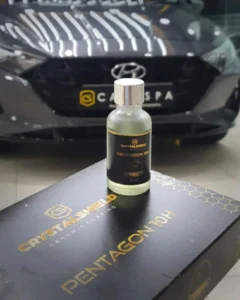 A CrystalShield Trinity 9H ceramic coating bottle