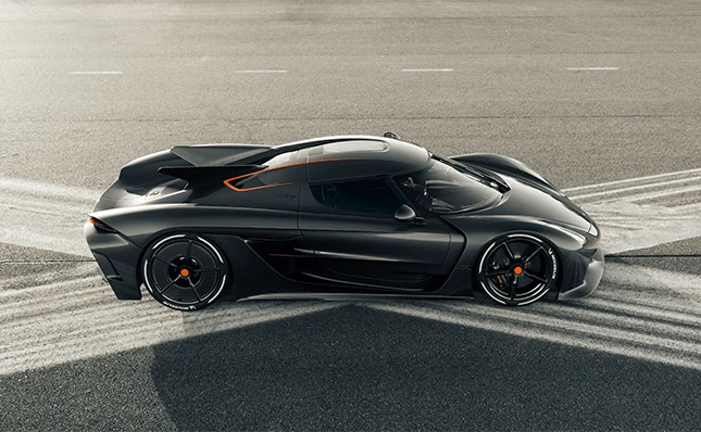 A black and orange Koenigsegg Jesko Absolut on the racetrack