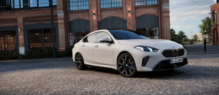 A white BMW 2 Series Gran Coupe parked on a streetside