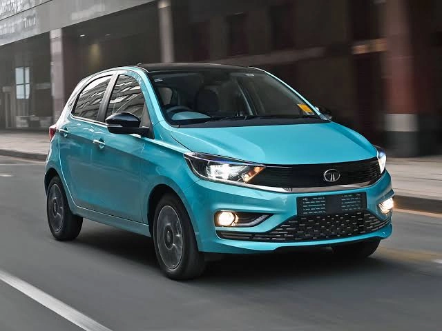 A Tata Tiago driving on a street