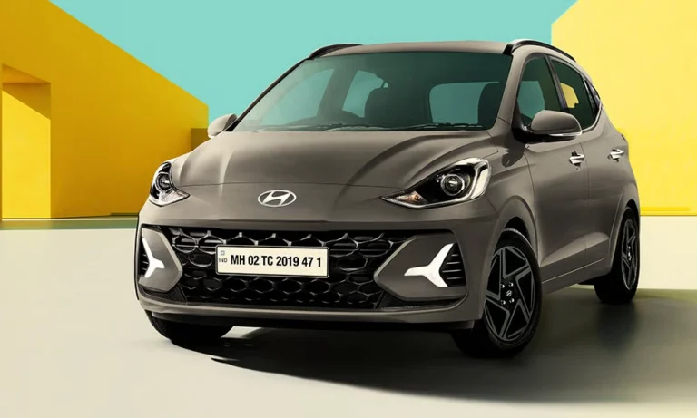 A Hyundai Grand i10 NiOS parked in a colourful backdrop