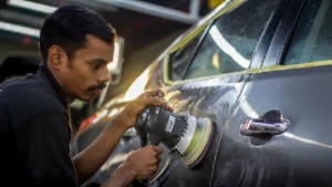 Professional car detailing service being performed inside a detailing studio