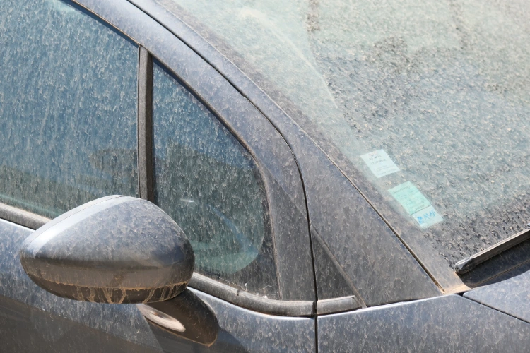 A layer of dust on a car